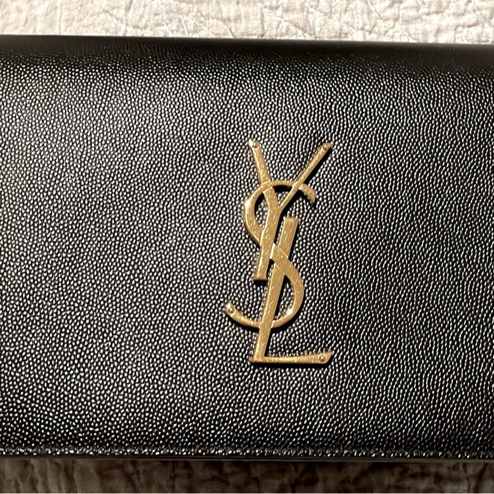Ysl black Kate clutch. Second owner. Minor wear. Very good used condition.